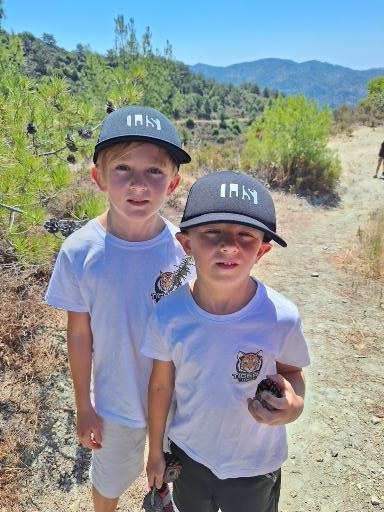 Two young Tiny Tigers on a summer camp hike