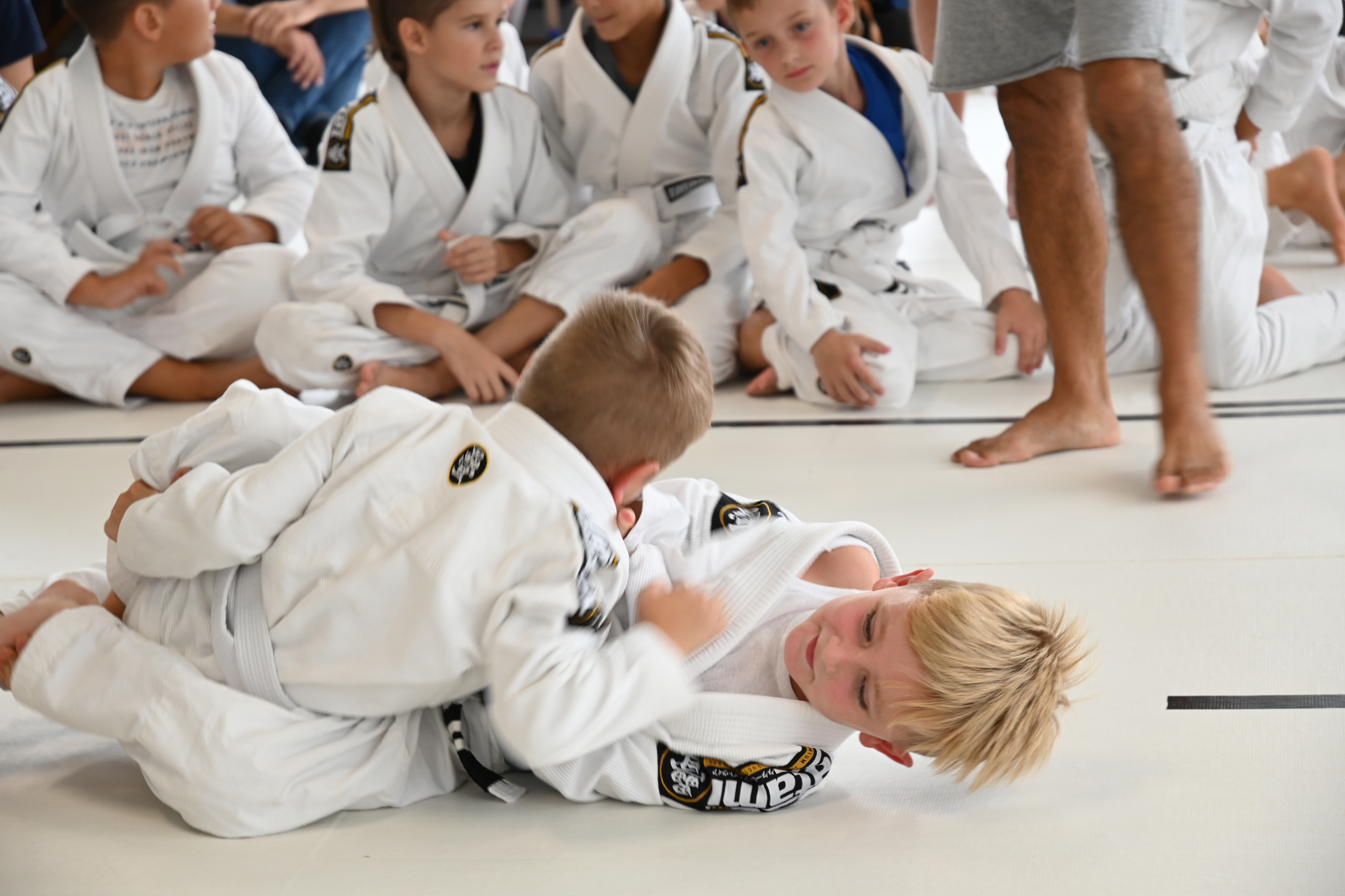 Kids competition match with crowd watching