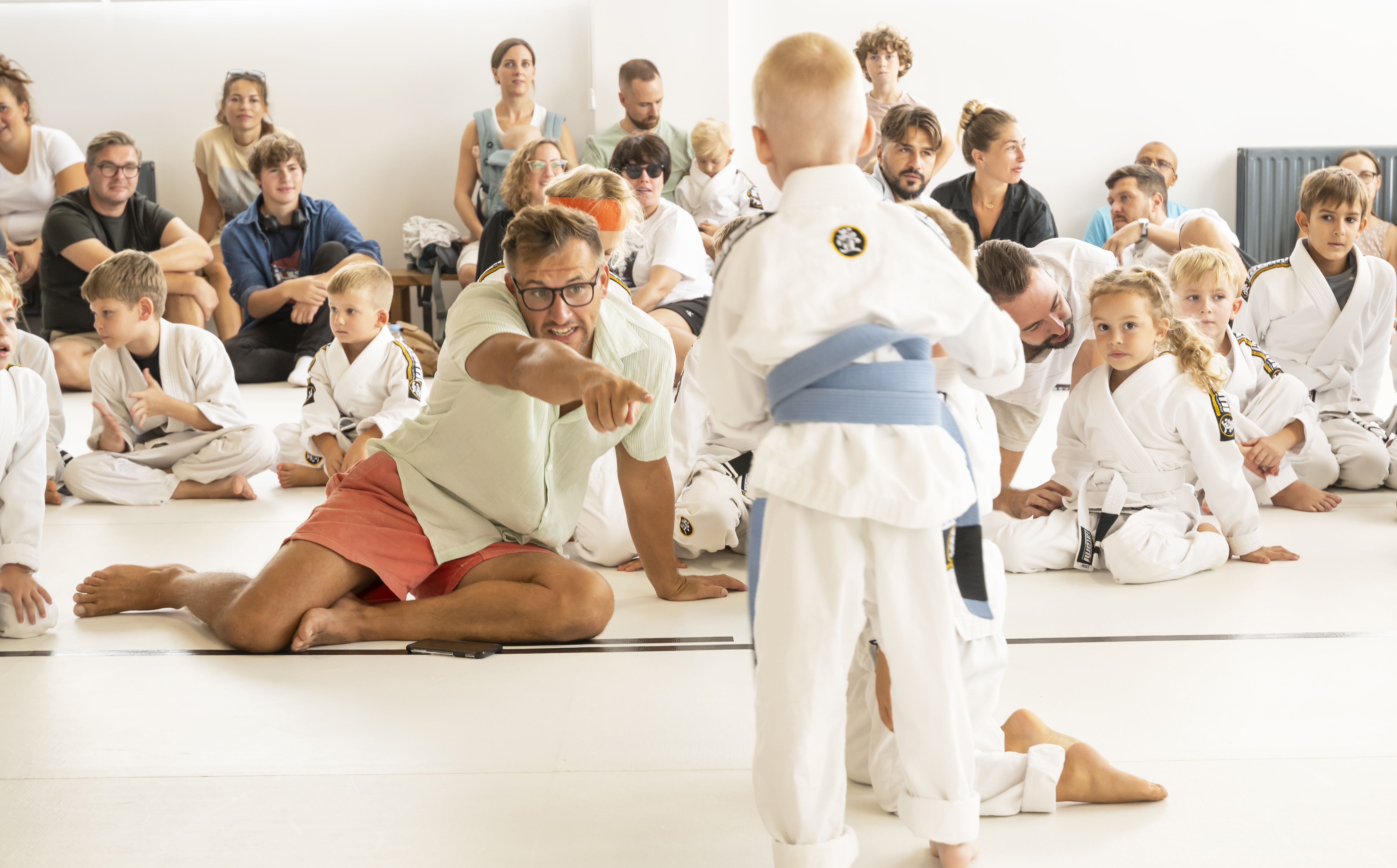 Coach instructing during event with audience