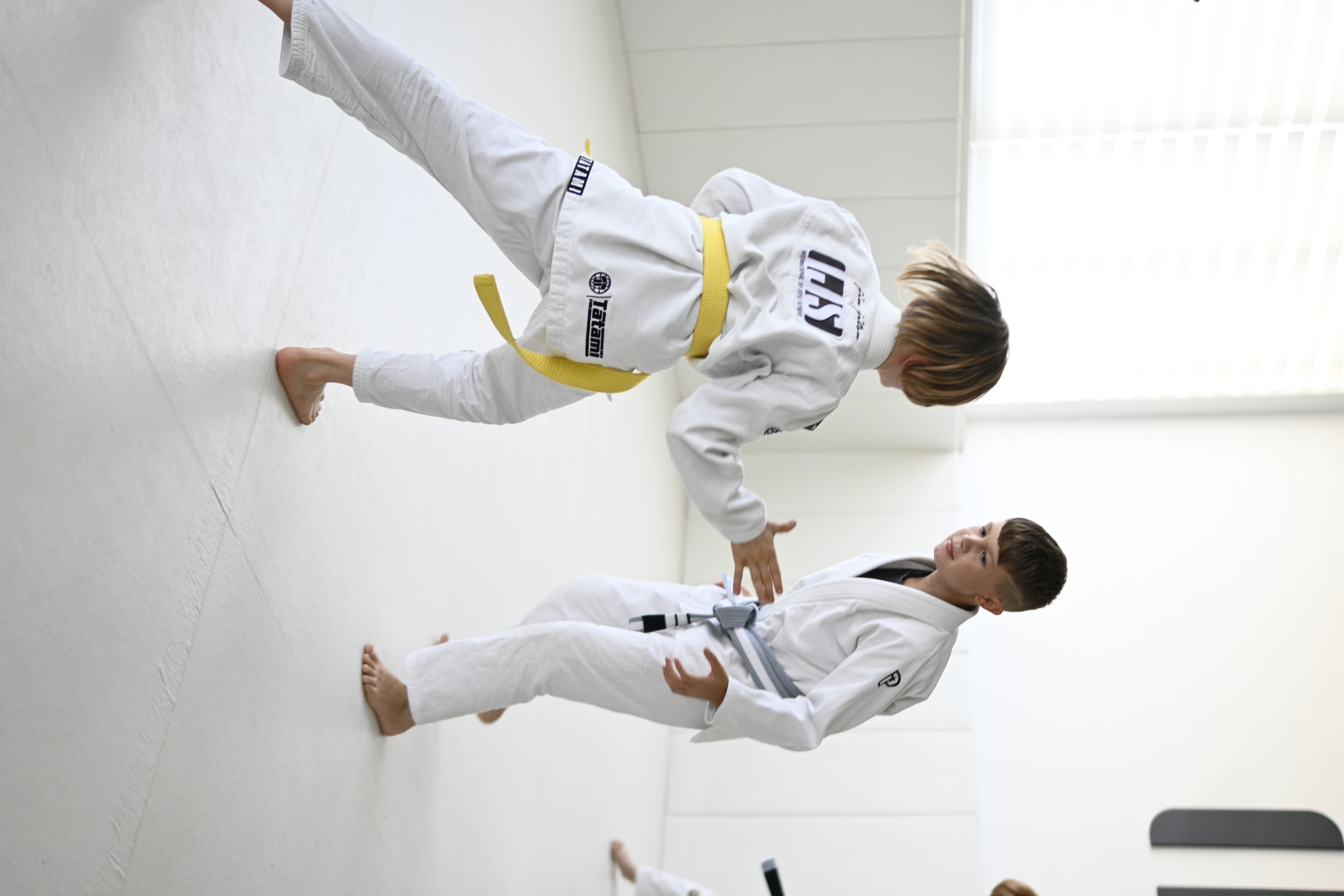 Two kids in stance facing off during training