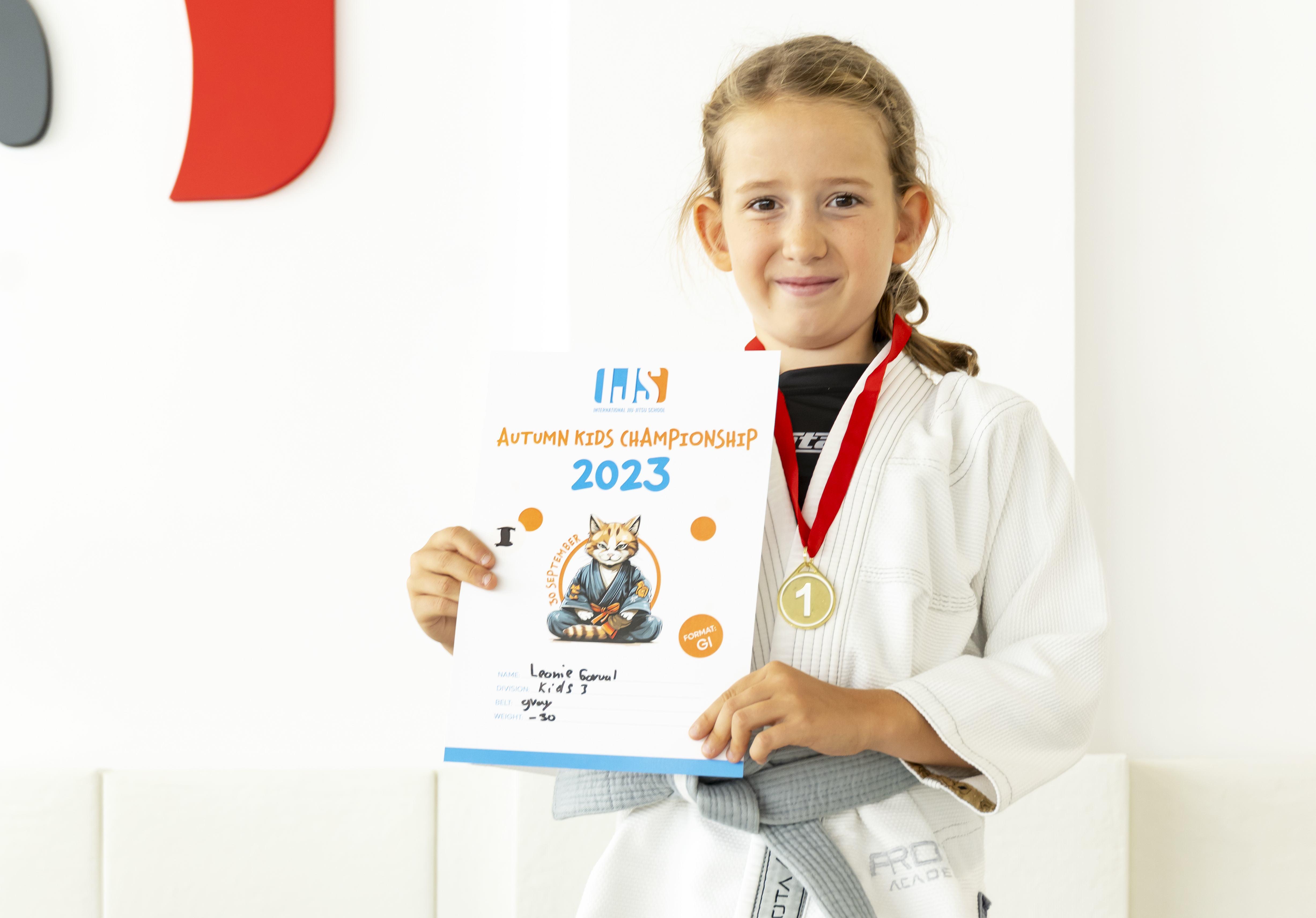 Young student with medal and championship certificate