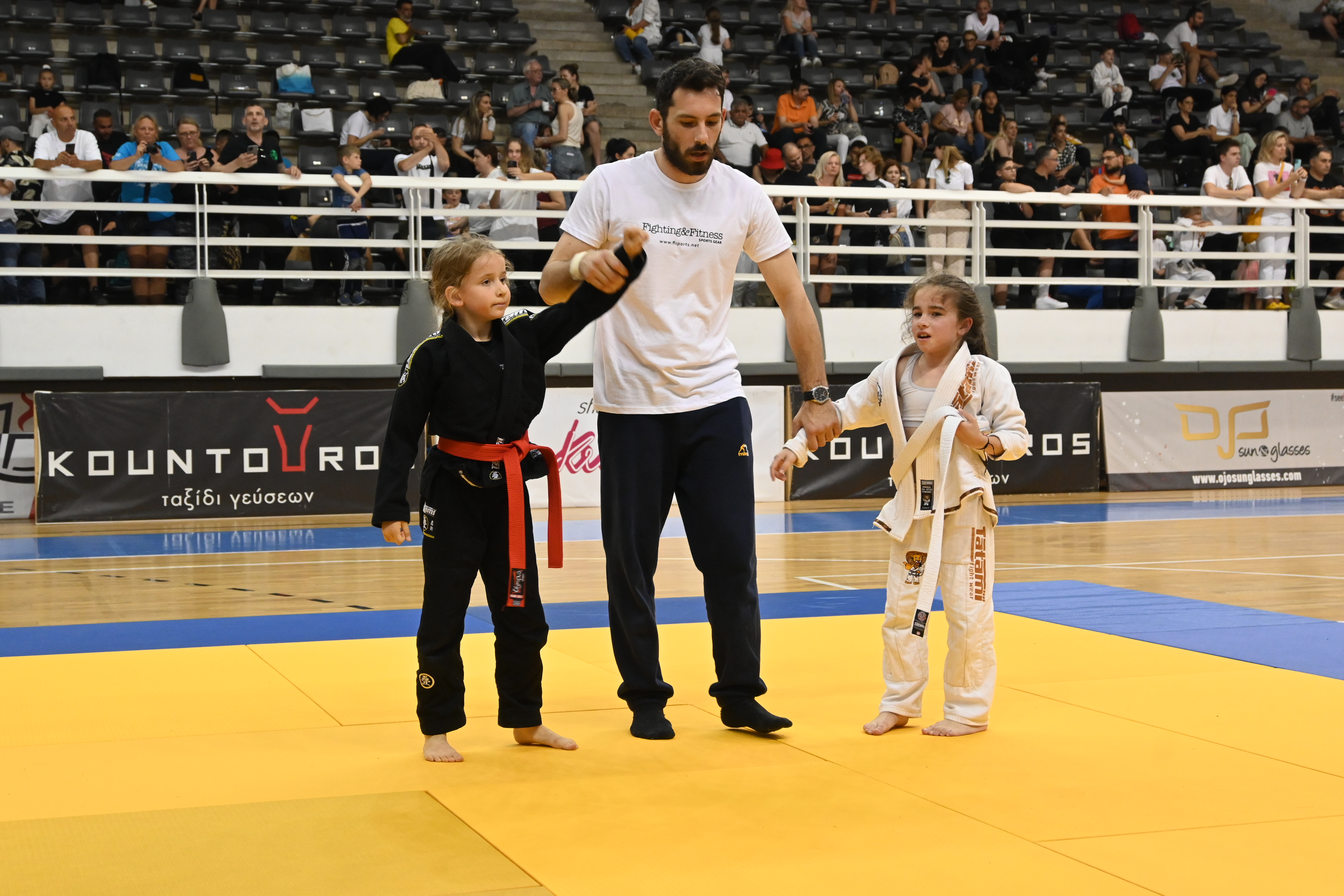 Young girls at external tournament with referee